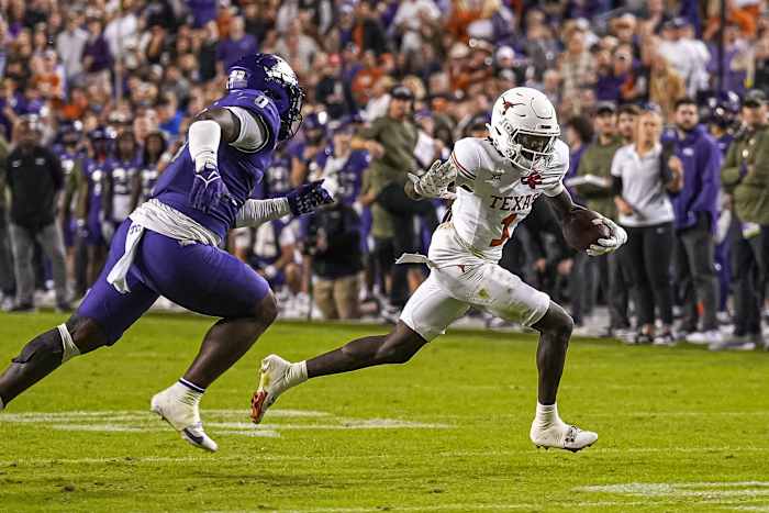 Texas Longhorns wide receiver Xavier Worthy (1) runs the ball against Texas Christian University at Amon G. Carter Stadium on Saturday, Nov. 11, 2023 in Fort Worth, Texas